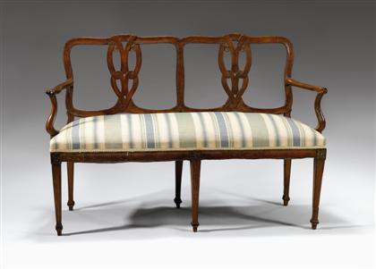 Appraisal: Northern Italian walnut chairback settee late th century The entwined