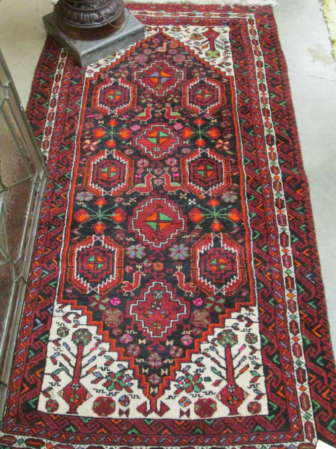 Appraisal: BELOUCHI TRIBAL AREA RUG hand knotted in an overall geometric