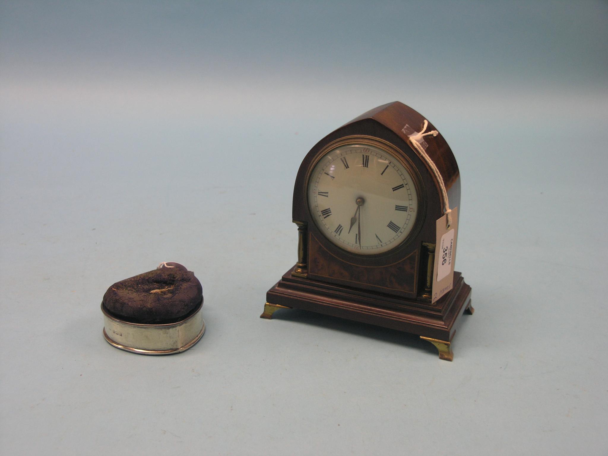 Appraisal: A mahogany and burr yew mantel clock lancet-shape with convex