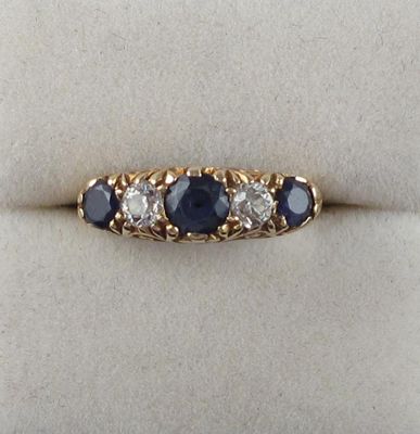 Appraisal: A sapphire and diamond five stone ring Set with two