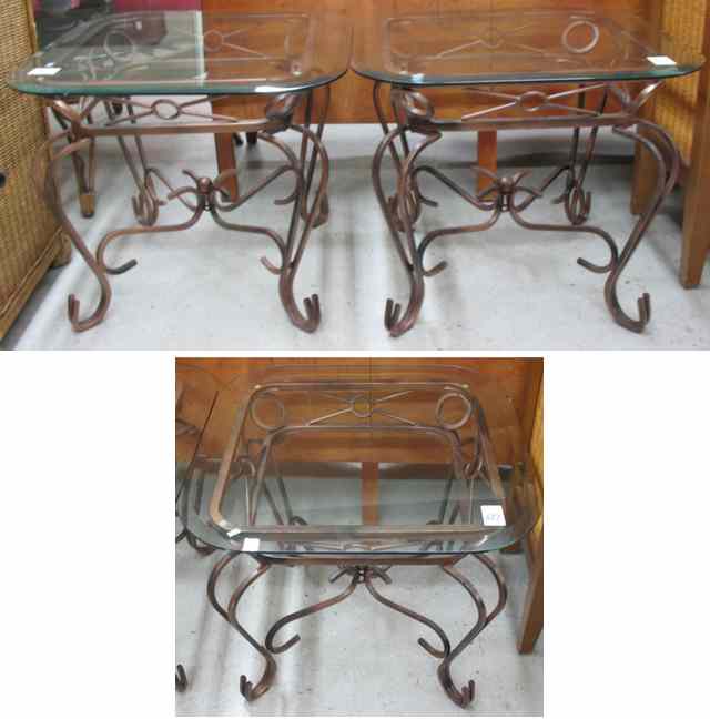 Appraisal: THREE GLASS-TOP IRON LIVING ROOM TABLES round sunburst coffee table