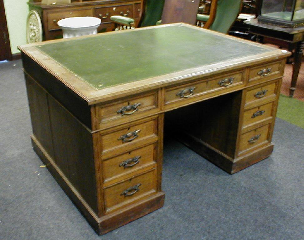 Appraisal: A late Victorian oak partners desk with leather inset top