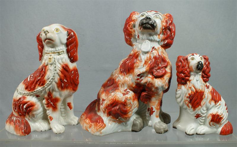 Appraisal: Staffordshire rust spaniels figures glaze flakes craquelure tallest Estimate -