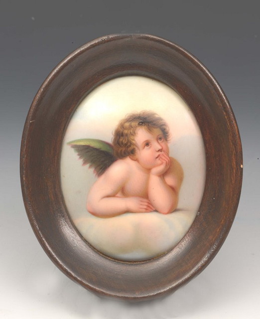 Appraisal: AN OVAL MINIATURE study of a cherub on porcelain in