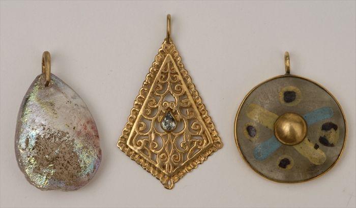 Appraisal: GROUP OF THREE PENDANTS WITH GLASS AND GOLD DECORATION Provenance