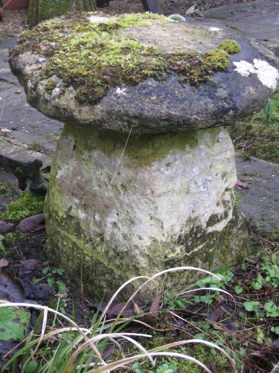 Appraisal: A circular sandstone Staddle Stone on squat square tapering base