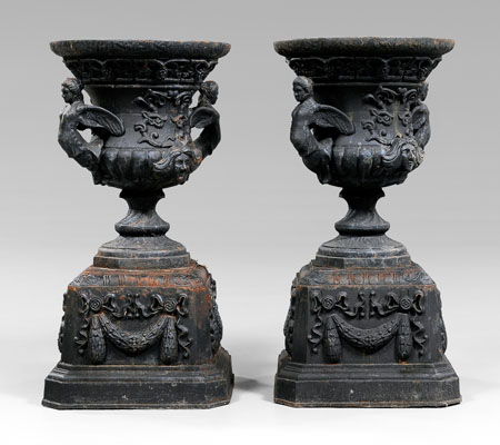 Appraisal: Pair figural cast iron garden urns typical form each with