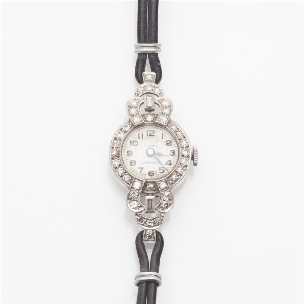 Appraisal: A diamond set cocktail watch the small circular dial with