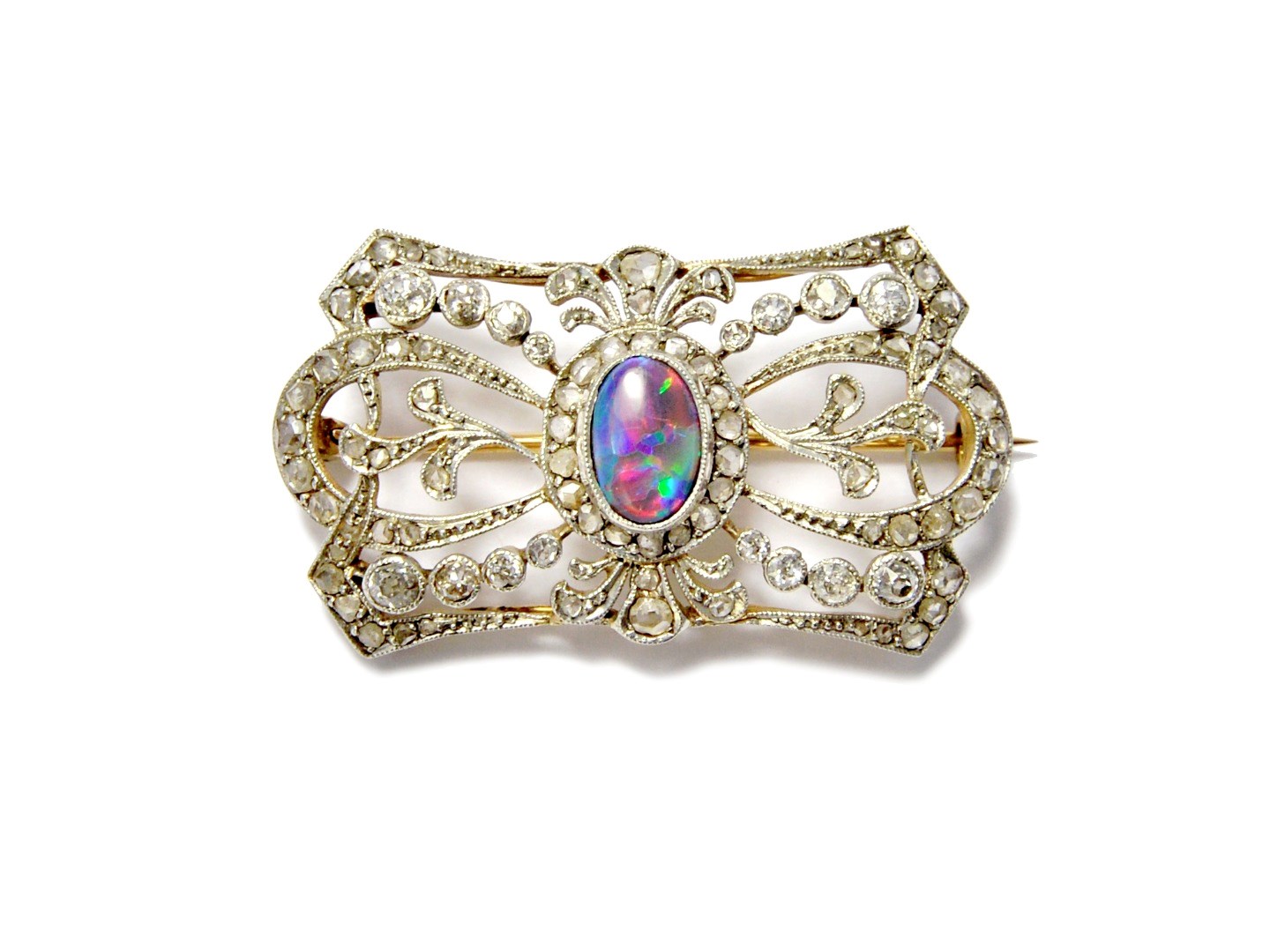 Appraisal: An opal and diamond set brooch in a shaped rectangular