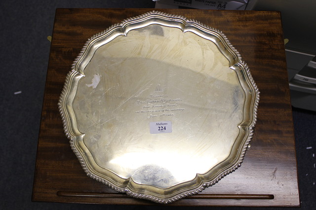 Appraisal: AN EDWARDIAN SILVER SALVER with shaped gadroon edge and standing