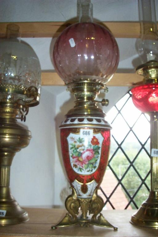 Appraisal: A th century cranberry glass oil lamp base with white