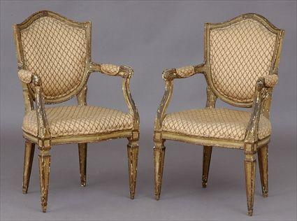 Appraisal: PAIR OF VENETIAN NEOCLASSICAL CARVED AND PAINTED SHIELD-BACK ARMCHAIRS Each