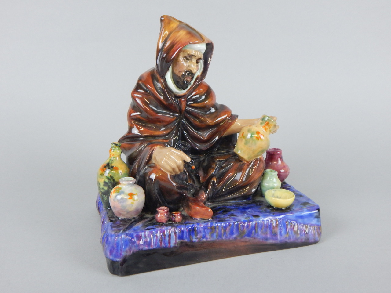 Appraisal: A Royal Doulton figure The Potter HN printed mark in