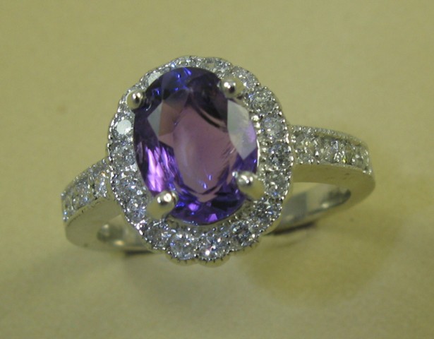 Appraisal: AMETHYST AND DIAMOND RING k white gold and centering an