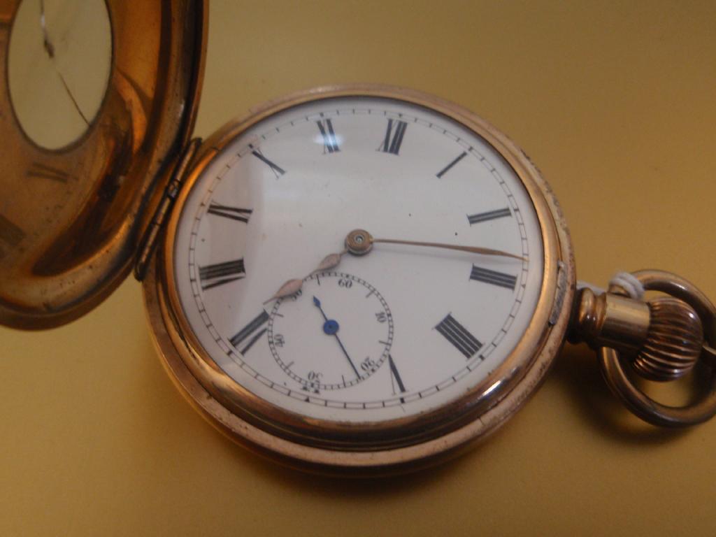 Appraisal: A gold plated half hunter pocket watch with large open