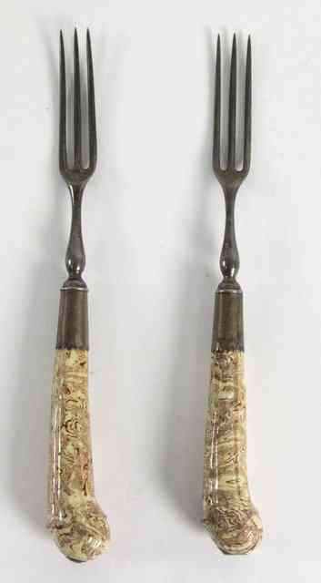 Appraisal: A pair of solid agateware forks creamware with steel tines