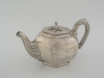 Appraisal: A Victoria Irish teapot of bulbous hexagonal form with a