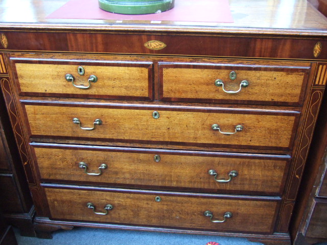 Appraisal: A George IV oak and mahogany crossbanded chest with two