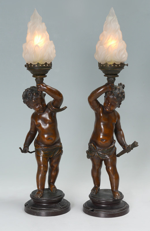 Appraisal: PAIR FRENCH PUTTI NEWELL POST LAMPS Patinated spelter cherubs with