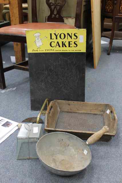 Appraisal: A LYONS CAKES TIN BLACKBOARD together with a grain scoop