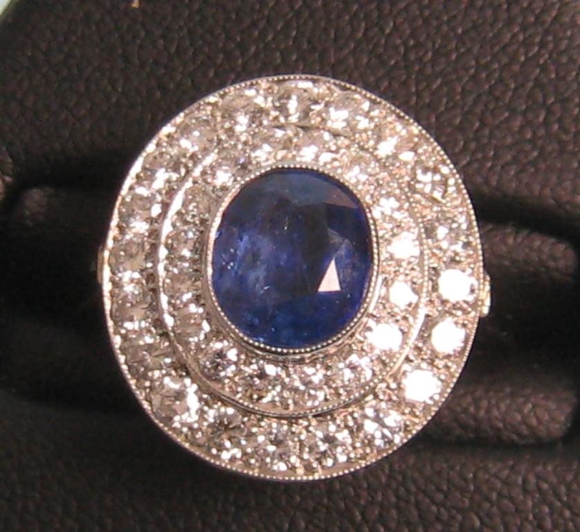 Appraisal: A Sapphire and Diamond Cocktail Ring the central oval shaped