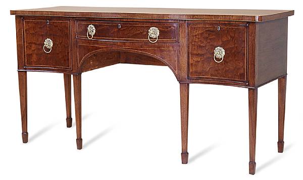 Appraisal: A George III style crossbanded mahogany sideboard The shaped top