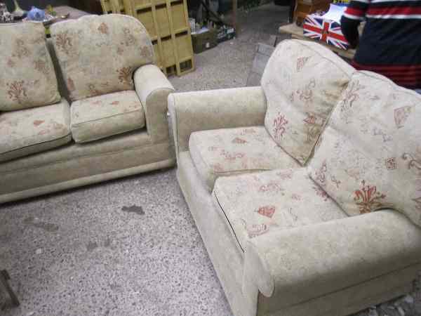 Appraisal: A pair of Draylon Beige Patterned Two Seater Settee's