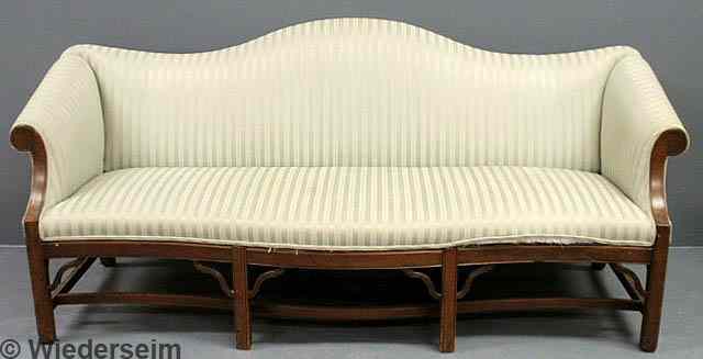 Appraisal: Chippendale mahogany camelback sofa th c with serpentine front skirt