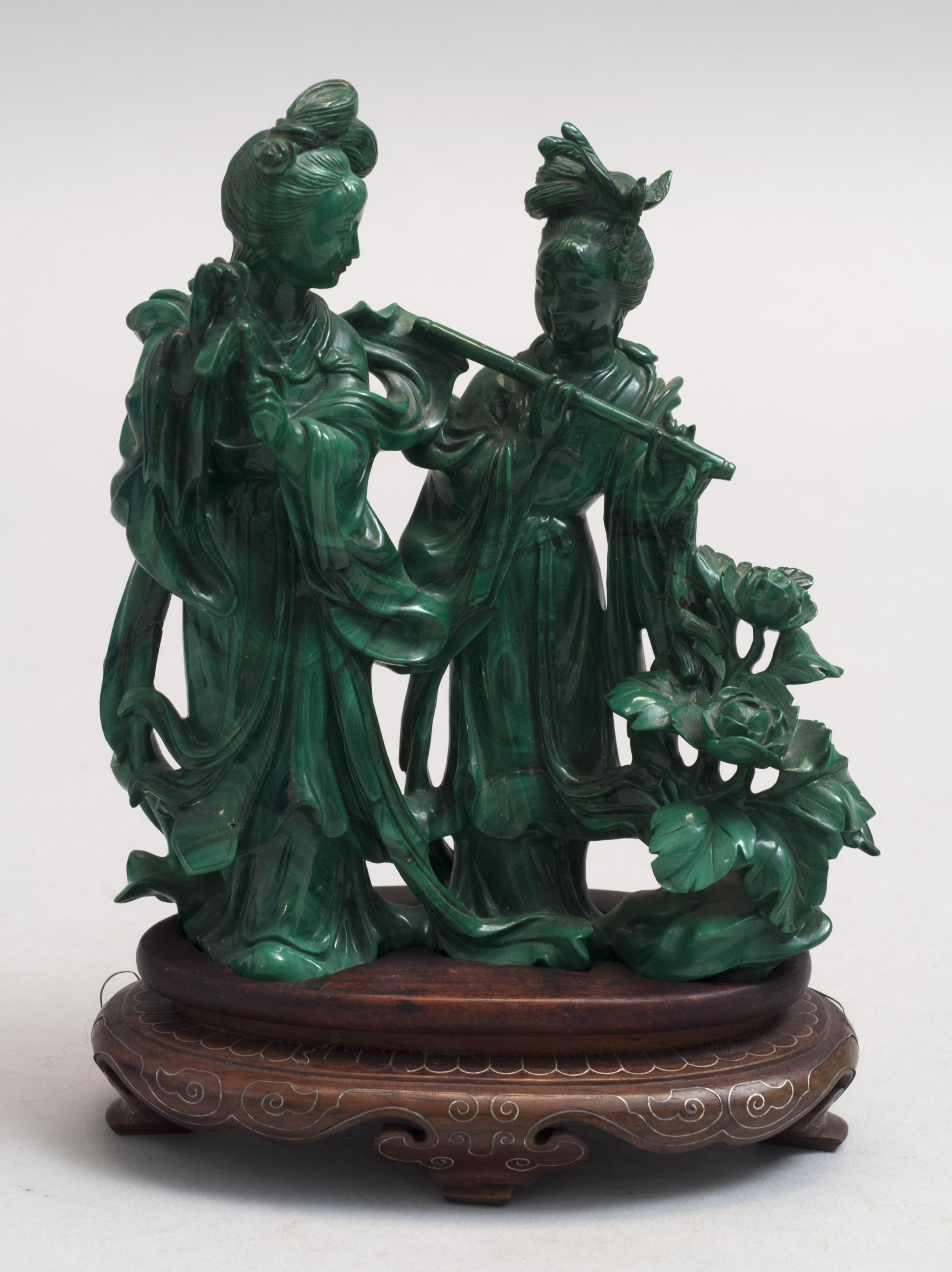 Appraisal: CARVED MALACHITE FIGURE GROUP Two female musicians in flowing robes