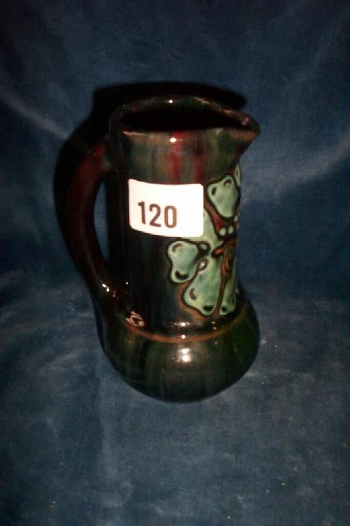 Appraisal: An Elton ware jug with drawn neck and loop handle