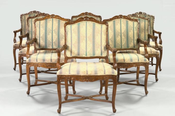 Appraisal: Suite of Eight Provincial Louis XV-Style Beechwood Armed Dining Chairs