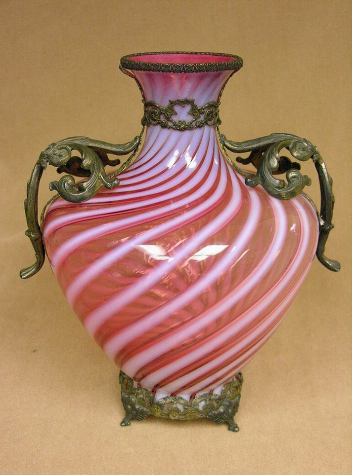 Appraisal: LARGE CRANBERRY OPALESCENT SWIRL VASE Bronze or brass mounted base