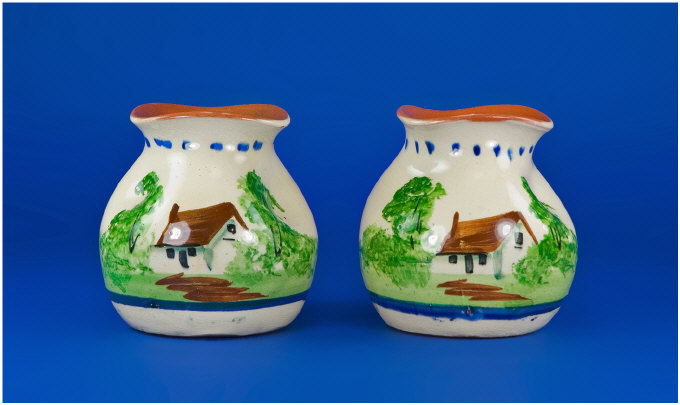 Appraisal: Pair of Torquay Motto Ware Vases Painted with houses and