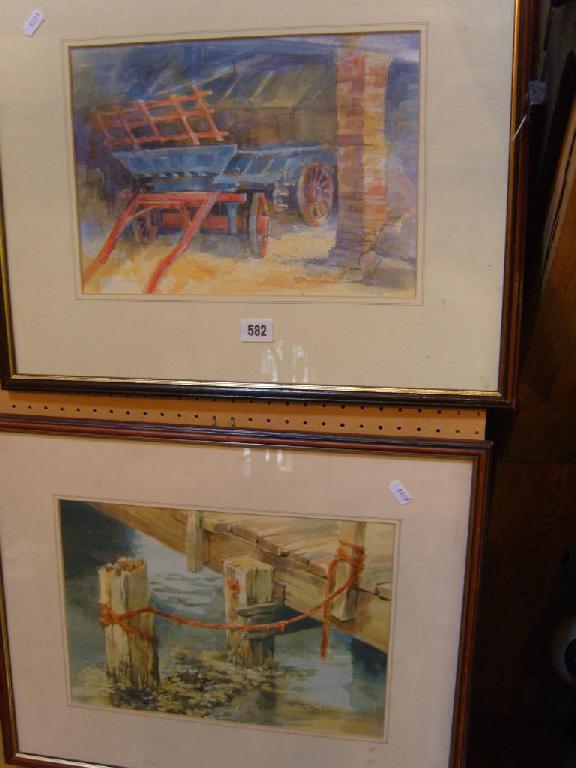 Appraisal: A pair of watercolours one showing a barn interior with