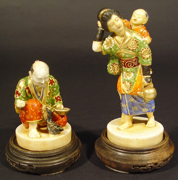 Appraisal: Two Japanese Satsuma pottery figure groups each with hand painted