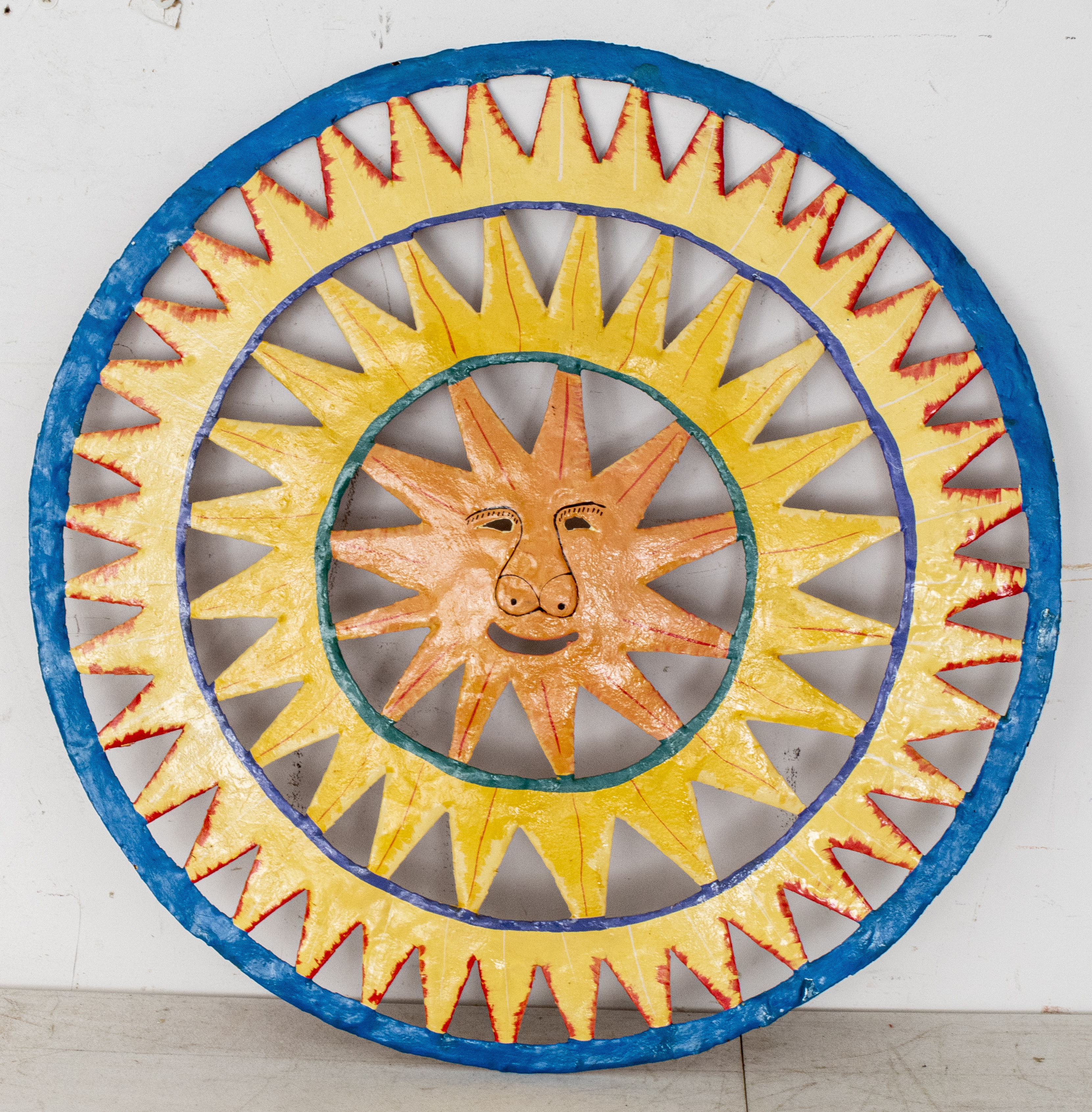 Appraisal: FOLK ART HAND PAINTED METAL SUN WALL HANGING Whimsical hand