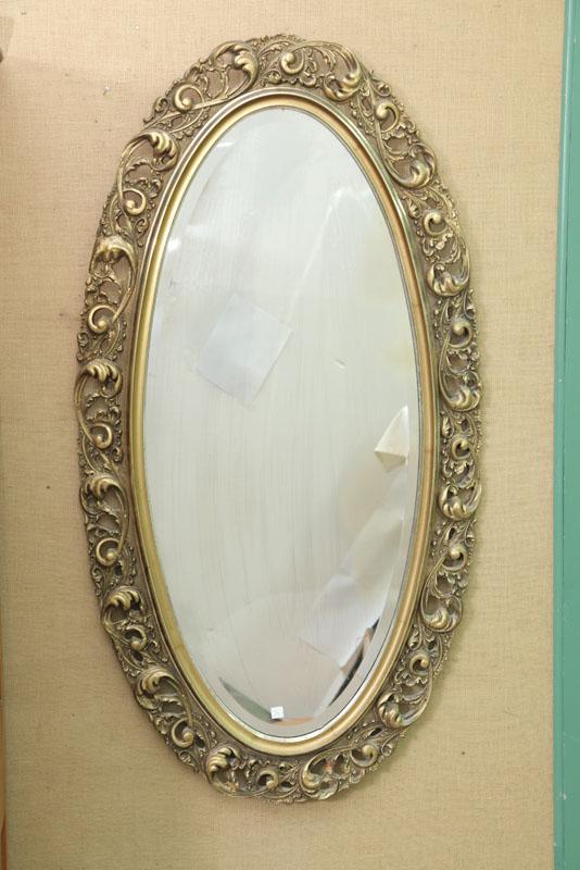 Appraisal: FRAMED MIRROR Oval gilt frame with pierced scrollwork design and