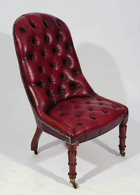 Appraisal: A GEORGE IV MAHOGANY LIBRARY CHAIR upholstered in deep button