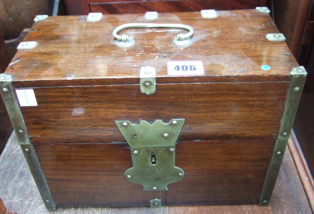 Appraisal: A Victorian stained oak travelling decanter box with metal mounts