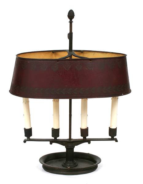 Appraisal: A French bronze bouillotte lamp with tole shade height in