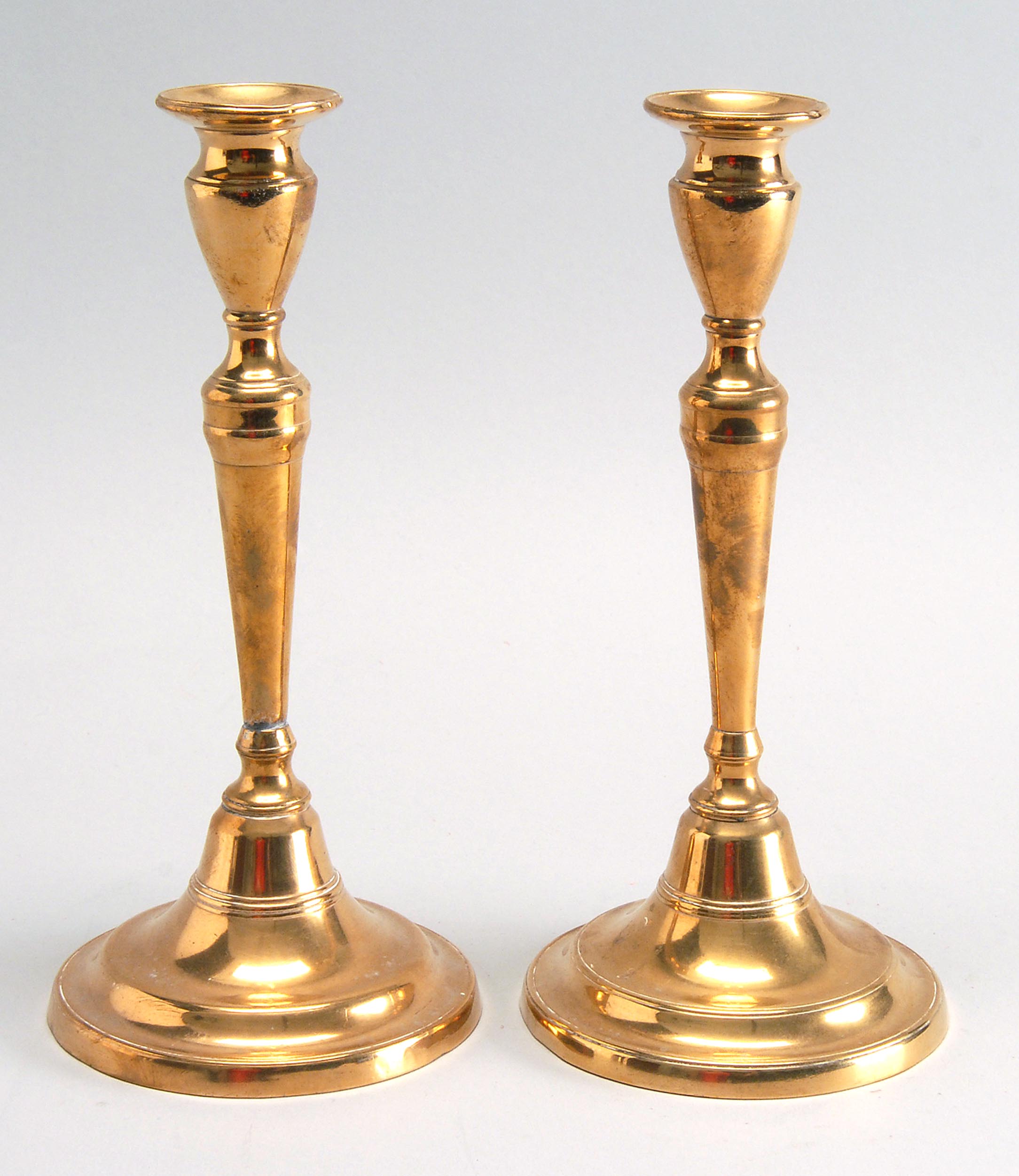 Appraisal: PAIR OF TH CENTURY BELL METAL PUSH-UP CANDLESTICKS Heights