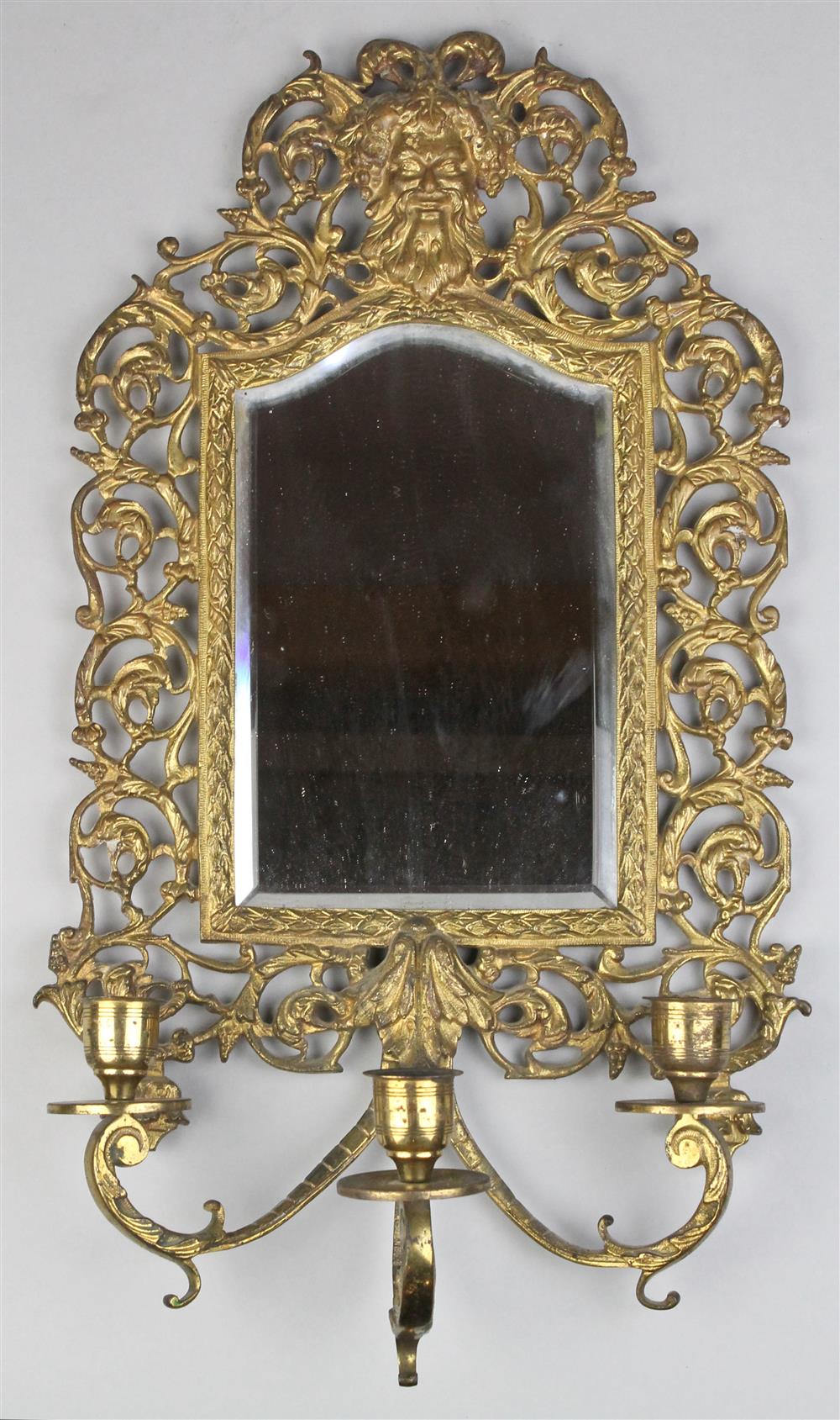 Appraisal: RENAISSANCE REVIVAL BRASS AND MIRRORED WALL SCONCE the rectangular mirror