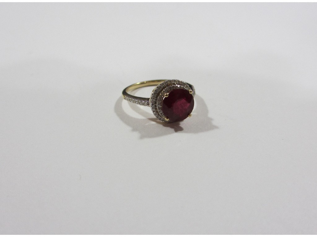 Appraisal: Fourteen carat gold ruby and diamond cluster ring with round