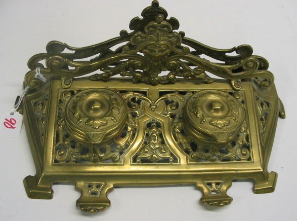 Appraisal: A FILIGREED BRASS INKSTAND having Northwind crested letter holder double