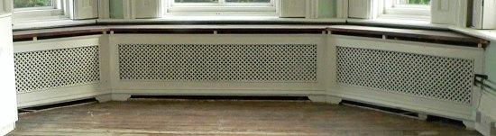 Appraisal: A triple pierced cast radiator surround with pierced returns and