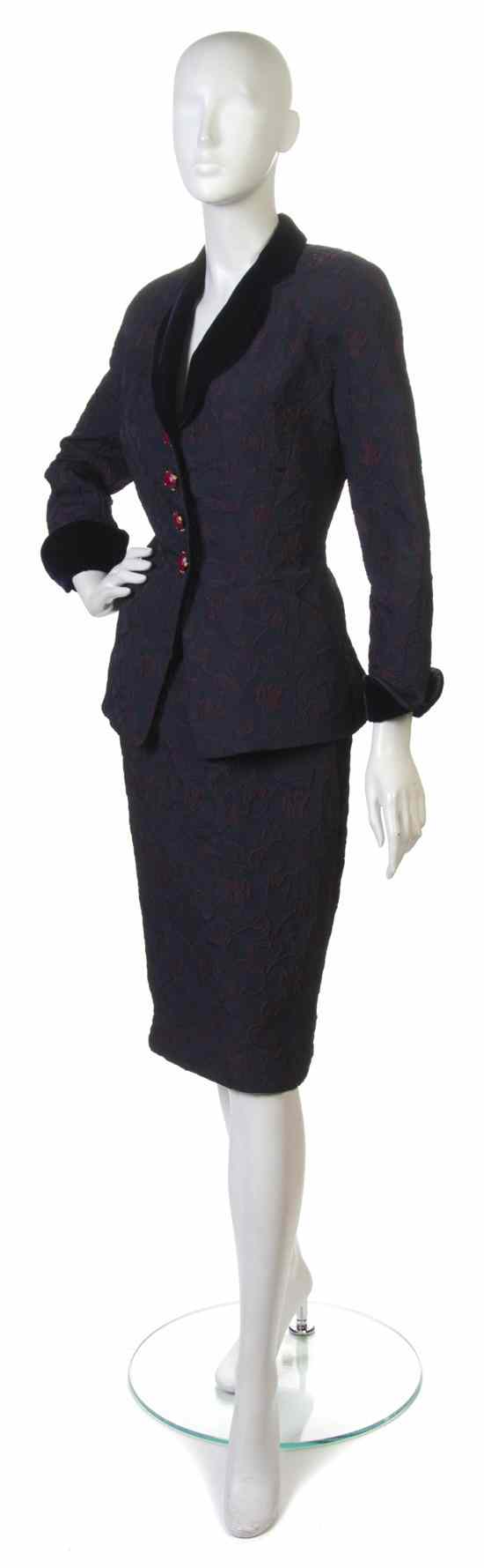 Appraisal: A Nina Ricci Navy Skirt Suit with burgundy embroidery All