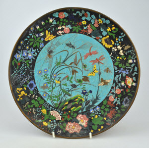 Appraisal: A Japanese cloisonne charger the centre decorated with insects spiders