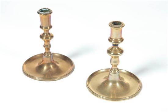 Appraisal: TWO BRASS CANDLESTICKS European th century Similar with baluster stems