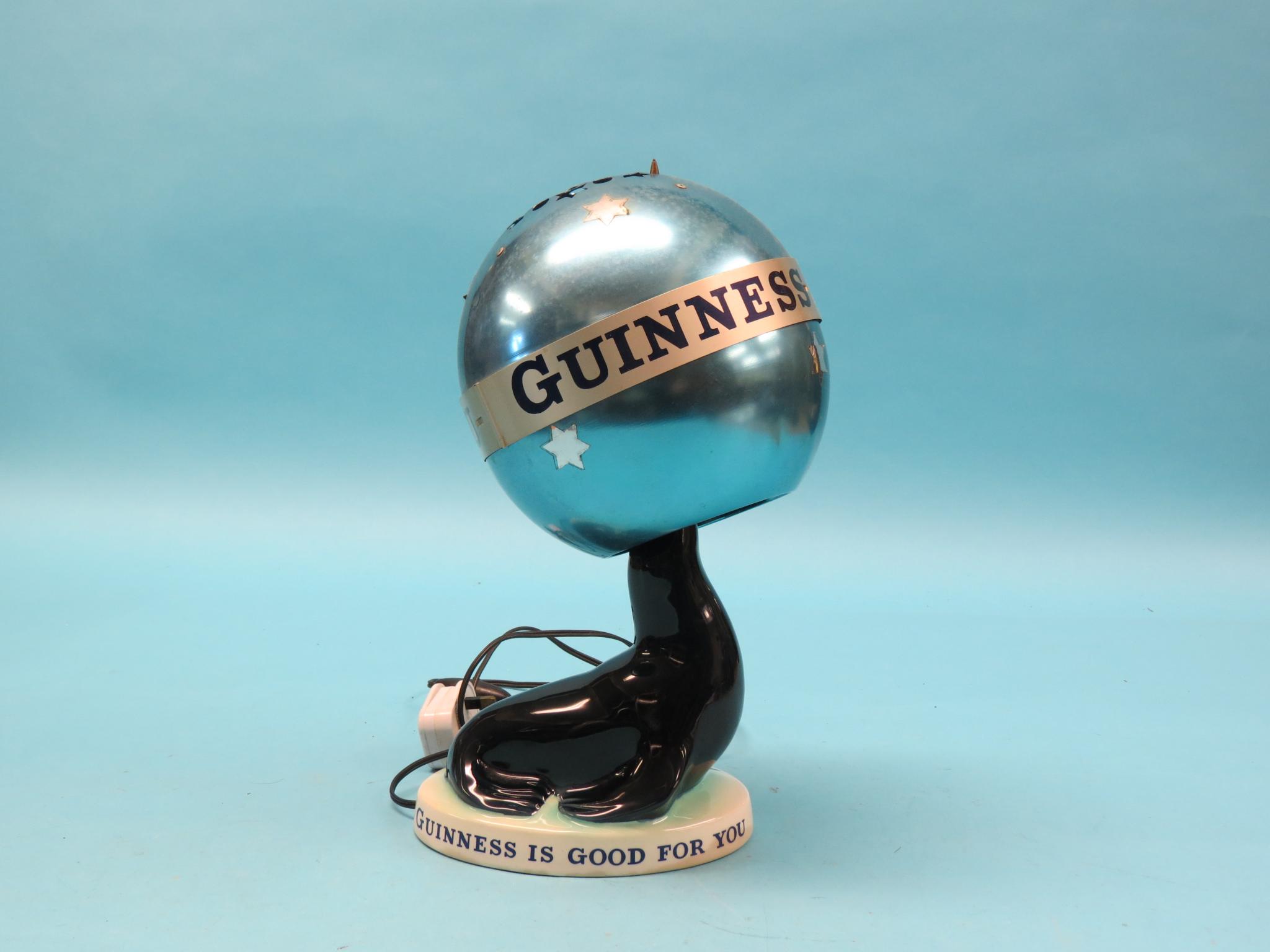 Appraisal: A Carltonware Guinness-advertising table lamp seal balancing ball in