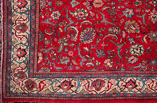 Appraisal: A MODERN HAMADAN RED GROUND RUG with a banded border